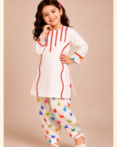 Little girl wearing Butterfly Bliss premium white embroidered shirt with colorful butterfly print trousers from Laj Apparel Summer Collection.