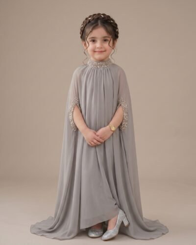 Little girl wearing elegant grey embellished cape gown by LAJ APPAREL
